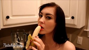 Erotic sucks a banana in the kitchen