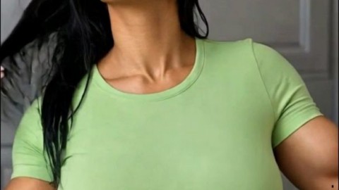 Hot Muscular Transgirl in Green Top Shows Off Her Bulge