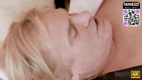 A light-haired gal gives a blowjob to her long