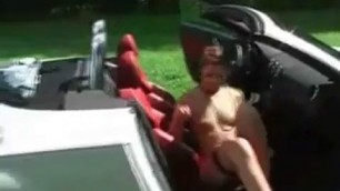 woman is masturbating in her car