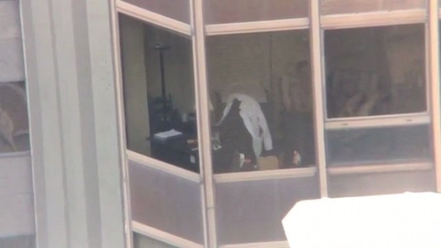 Couple Having Sex in Building